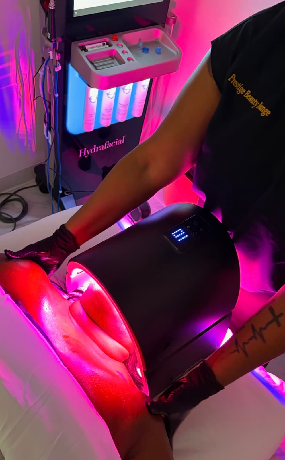 A HydraFacial treatment in progress with LED light therapy at Prestige Beauty Lounge